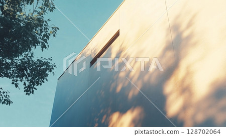 White facade of modern building and tree shadow wall when sun bright 128702064