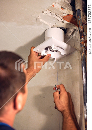 Mechanical man hand working fix electric drill motor roter fix repair shop 128702871