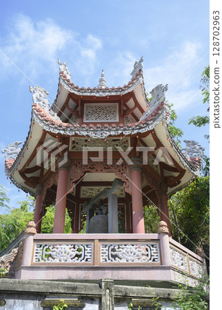 Buddhist gazebo with wooden ornaments and an ancient bell in Long Son Pagoda in Nha Trang, Vietnam 128702963