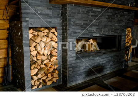 fireplace in the house with a woodpile 128703208