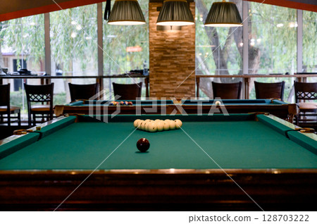 Billiard Table with balls and cue 128703222