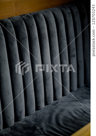 Detail of a sofa with grey upholstery 128703243