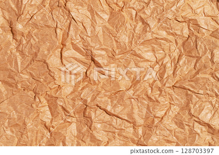 Crumpled blank sheet of brown wrapping kraft paper, vintage texture for the designer. Background of crumpled blank sheet Crumpled blank sheet of brown wrapping kraft paper, vintage texture for the designer. Background of crumpled blank sheet 128703397