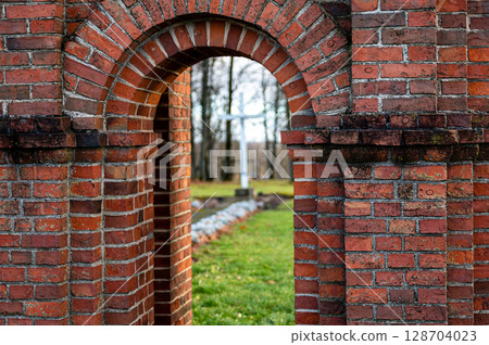 Old Catholic Church red brick gates in city Akniste, Latvia. Closeup 128704023
