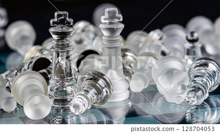 glass chess board game in black background ,selective focus on King, leadership concept glass chess board game in black background ,selective focus on King, leadership concept 128704053