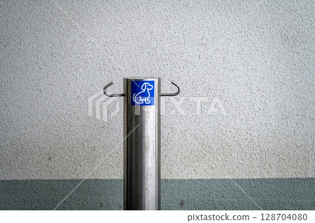 Dog parking sign. Place for bind dogs waiting for owners outside on public place area or shop. 128704080