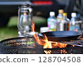 Red-hot campfire and frying pan 128704508