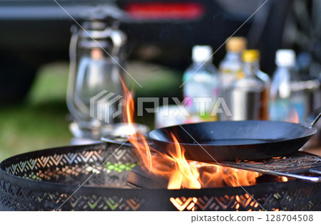 Red-hot campfire and frying pan 128704508