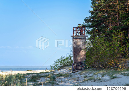 The old fishermen's lighthouse on Ragaciema beach, built in 1875, destroyed during the war The old fishermen's lighthouse on Ragaciema beach, built in 1875, destroyed during the war 128704696