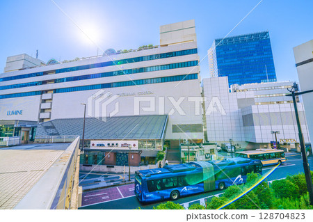 Yokohama cityscape in Japan. View of the east exit of Yokohama Station (center) and the Yokohama Bayside Blue (out-of-service train) 128704823