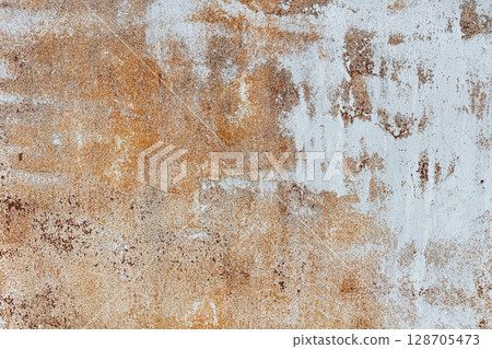 A close-up of a textured surface features a weathered mix of rust-orange and white tones A close-up of a textured surface features a weathered mix of rust-orange and white tones 128705473