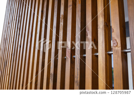 Wall made of wooden slats, natural materials for renovation 128705987