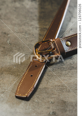 Handmade leather belt with a golden buckle. Belt for trousers Handmade leather belt with a golden buckle. Belt for trousers 128706026