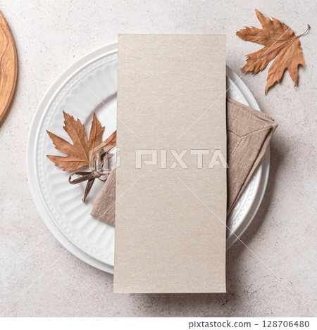 Blank 4x9 menu card  on table setting with autumn leaves 128706480