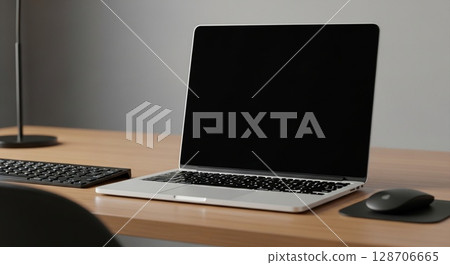Modern laptop computer on a light wooden desk with keyboard and mouse. Modern laptop computer on a light wooden desk with keyboard and mouse. 128706665