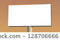 A blank white billboard stands against a gradient background, ready for advertising or a message. 128706666