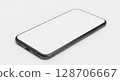 Gray smartphone with blank white screen, angled view, on a plain white surface. 128706667
