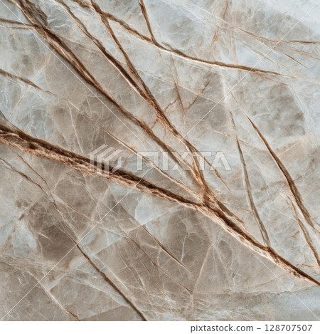 Neutral Truffle marble with soft beige and taupe tones and sharp brown veining in macro texture 128707507
