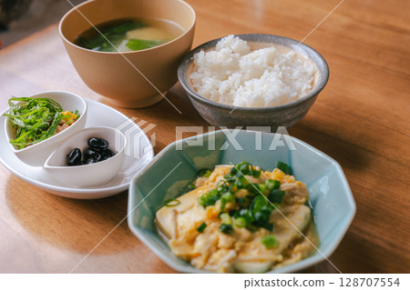 Healthy Japanese breakfast of tofu with eggs and natto 128707554