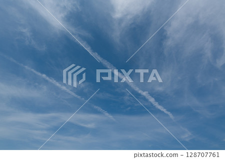 A white wake painted in the summer sky 128707761