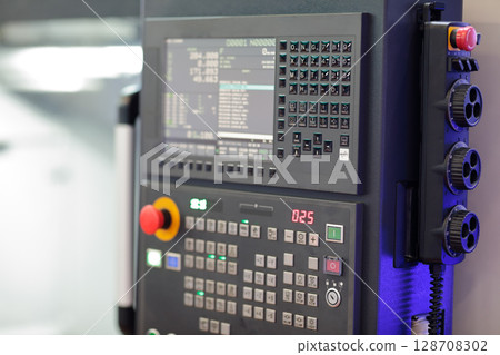 metalworking machine CNC control panel close up 128708302