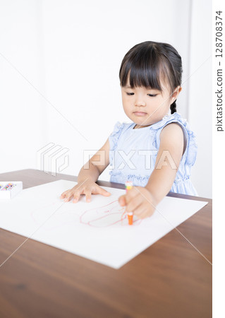 Educational scene of a girl enjoying drawing with crayons 128708374