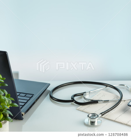 Doctor's office desk with laptop, medical documents, cardiogram, tonometer and stethoscope on a blue background with copy space. Medicine, medication treatment and medical examination concept Doctor's office desk with laptop, medical documents, cardiogram, tonometer and stethoscope on a blue background with copy space. Medicine, medication treatment and medical examination concept 128708486