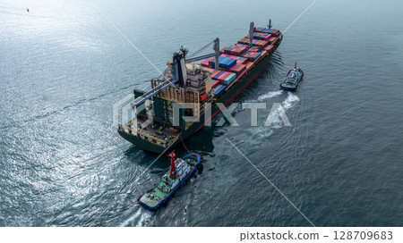 Aerial view from drone, Container ship or cargo shipping business logistic import and export freight transportation by container ship in open sea, Container loading cargo freight ship boat. 128709683