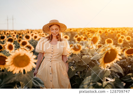 Pretty woman in retro dress posing in sunflowers. Yellow colors, Vintage fashion 128709747