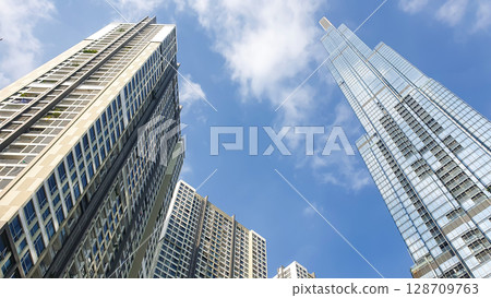 Exterior View Of Modern Skyscraper And High Rise Residential Buildings. Exterior View Of Modern Skyscraper And High Rise Residential Buildings. 128709763