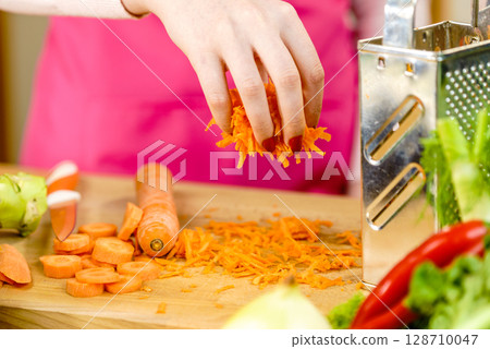 Grated orange carrot for salad Grated orange carrot for salad 128710047