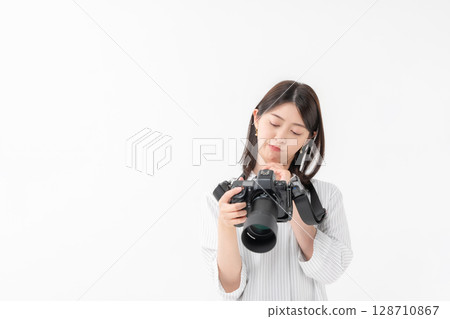 A woman with a camera A woman with a camera 128710867