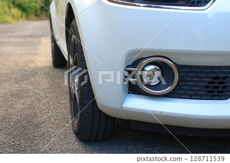 Fog lights on the front bumper of a car 128711539