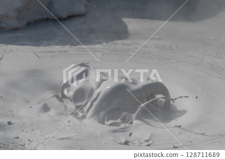 Beppu Bozu Jigoku: A geothermal scene of mud spewing out 128711689