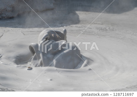 Beppu Bozu Jigoku: A geothermal scene of mud spewing out 128711697