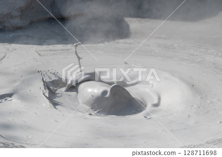 Beppu Bozu Jigoku: A geothermal scene of mud spewing out 128711698