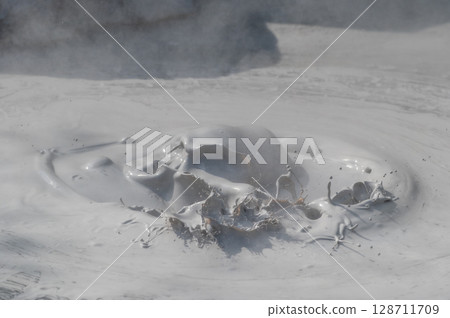 Beppu Bozu Jigoku: A geothermal scene of mud spewing out 128711709