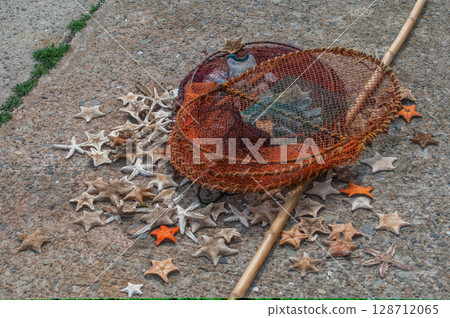 Dried starfish: A quiet fishing port scene Dried starfish: A quiet fishing port scene 128712065