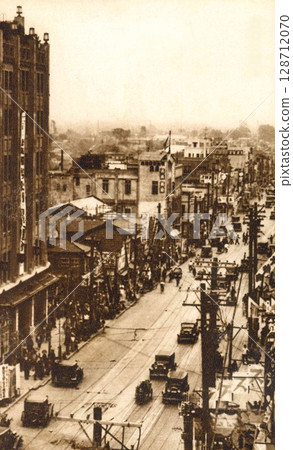 Old photo taken in 1932 in front of Isetan on Meiji Street in Shinjuku 3-chome, Tokyo 128712070