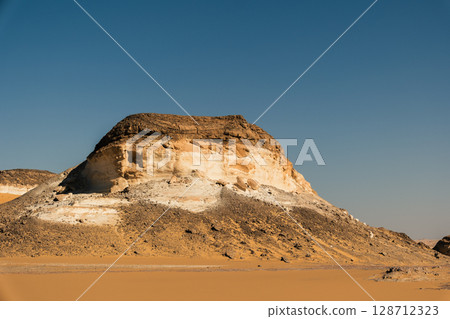 White rock formations and sand dunes in Egypt's White Desert, natural desert landscape	 128712323