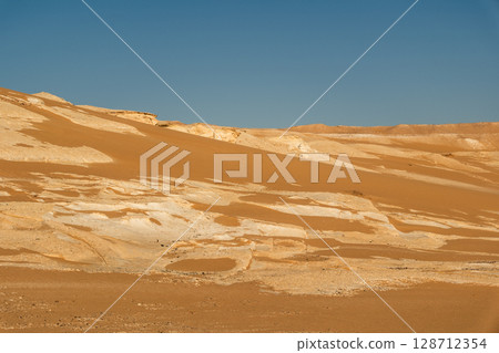 White rock formations and sand dunes in Egypt's White Desert, natural desert landscape	 128712354