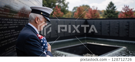 Emotional Tribute at Veteran Memorial with Flag and Soldier in Military Uniform 128712726