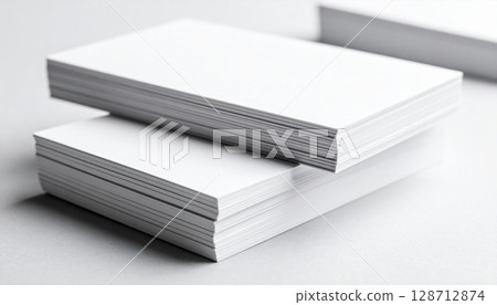 A stack of blank black and white notebooks with an open book and pen on a white background, perfect for business and education design templates A stack of blank black and white notebooks with an open book and pen on a white background, perfect for business and education design templates 128712874