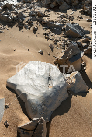 Close-up of a natural quartz formation inside a cave. The detailed crystal structure and layers of the mineral 128712929