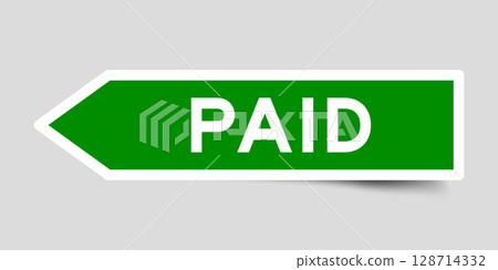 Green color arrow shape sticker label with word paid on gray background 128714332