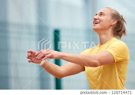 Smiling woman enjoying outdoor activity in casual yellow sportswear 128714471