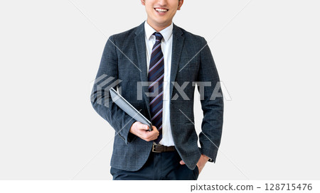 Smiling male businessman holding a tablet Smiling male businessman holding a tablet 128715476