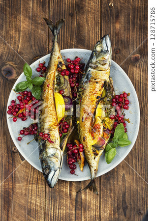 Baked mackerel fish with berries, seafood 128715786