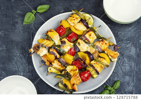 Grilled fish on skewers. Grilled fish on skewers. 128715788