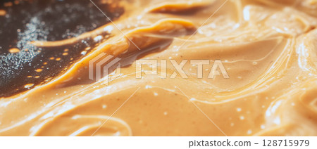 Smooth and creamy peanut butter fudge reveals a rich, nutty treat perfect for candy lovers. 128715979